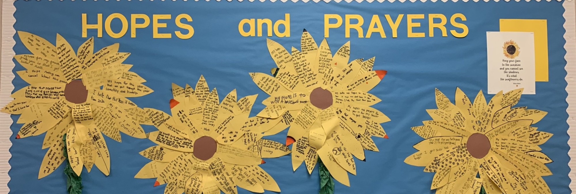 A bulletin board with yellow flowers on it with Hopes and Prayers Quotes