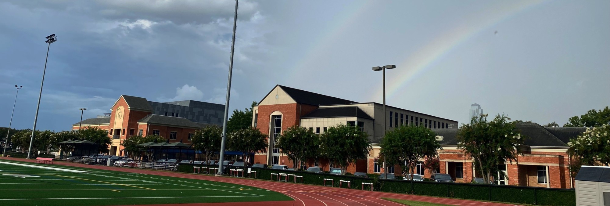 A rainbow appears over a sports field at River Oaks Baptist School